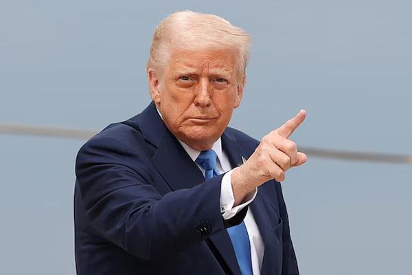 U.S. President Donald Trump gestures, before boarding Air Force One as he departs for Florida, at Joint Base Andrews, Maryland, U.S., March 28, 2025. REUTERS