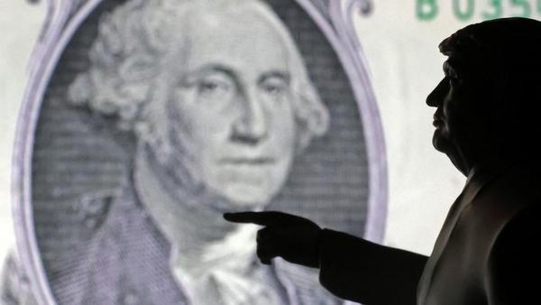 A 3D-printed miniature model depicting U.S. President Donald Trump and representation of U.S. dollar banknote in this illustration taken, April 17, 2025. REUTERS