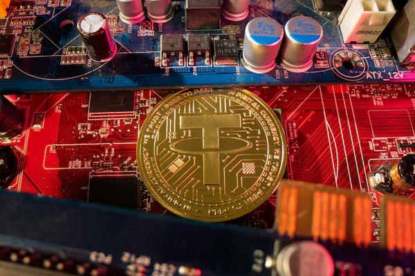 A representation of cryptocurrency Tether on a PC motherboard
