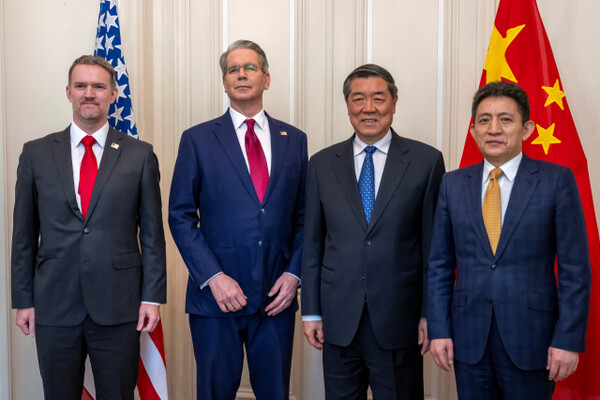 U.S. and Chinese trade officials pose for a photo before their bilateral meeting in Geneva.