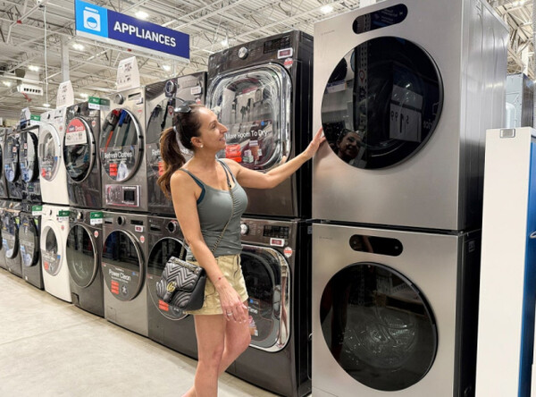 A customer examines LG Signature washing machine and dryer products at a Lowe’s store in the U.S.