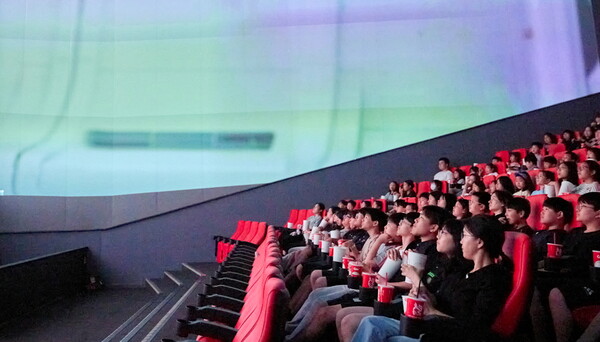 Children enjoying a movie at SCREENX special screening