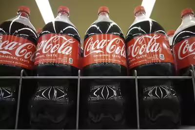 Bottles of Coca-Cola are displayed at a grocery store in Mount Prospect, Ill., Thursday, July 17, 2025. (AP Photo/Nam Y. Huh) Early rains, Pak conflict hit Coke's India biz: CEO