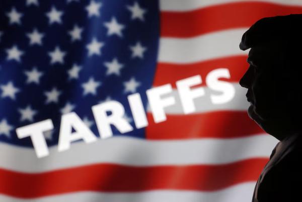 A 3D-printed miniature model of U.S. President Donald Trump, U.S. Flag and word 'Tariffs'
