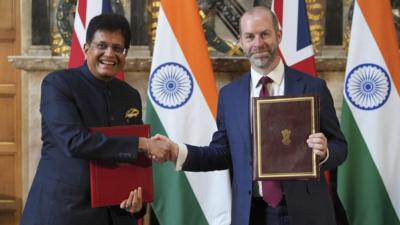 Union minister Piyush Goyal and Britain's secretary of state for business and trade, Jonathan Reynolds, shake hands after signing the free trade agreement. (Picture credit: AP) India-UK FTA Signing