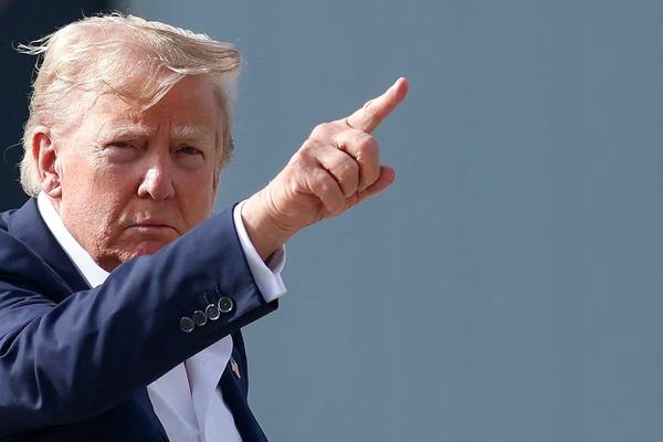 U.S. President Donald Trump gestures before boarding Air Force One