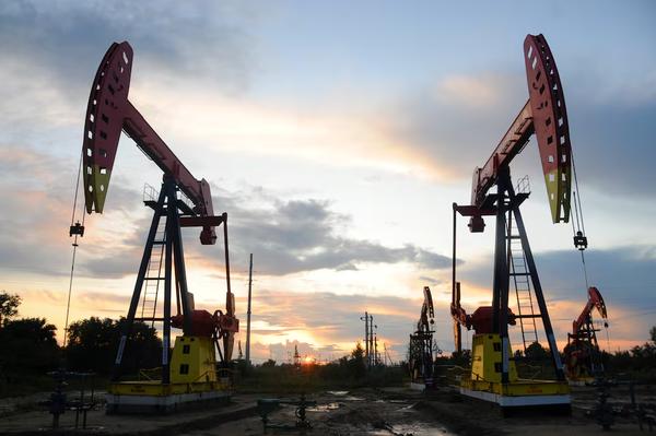 Pumpjacks at sunset in the Daqing oil field, Heilongjiang province, China, August 22, 2019. REUTERS